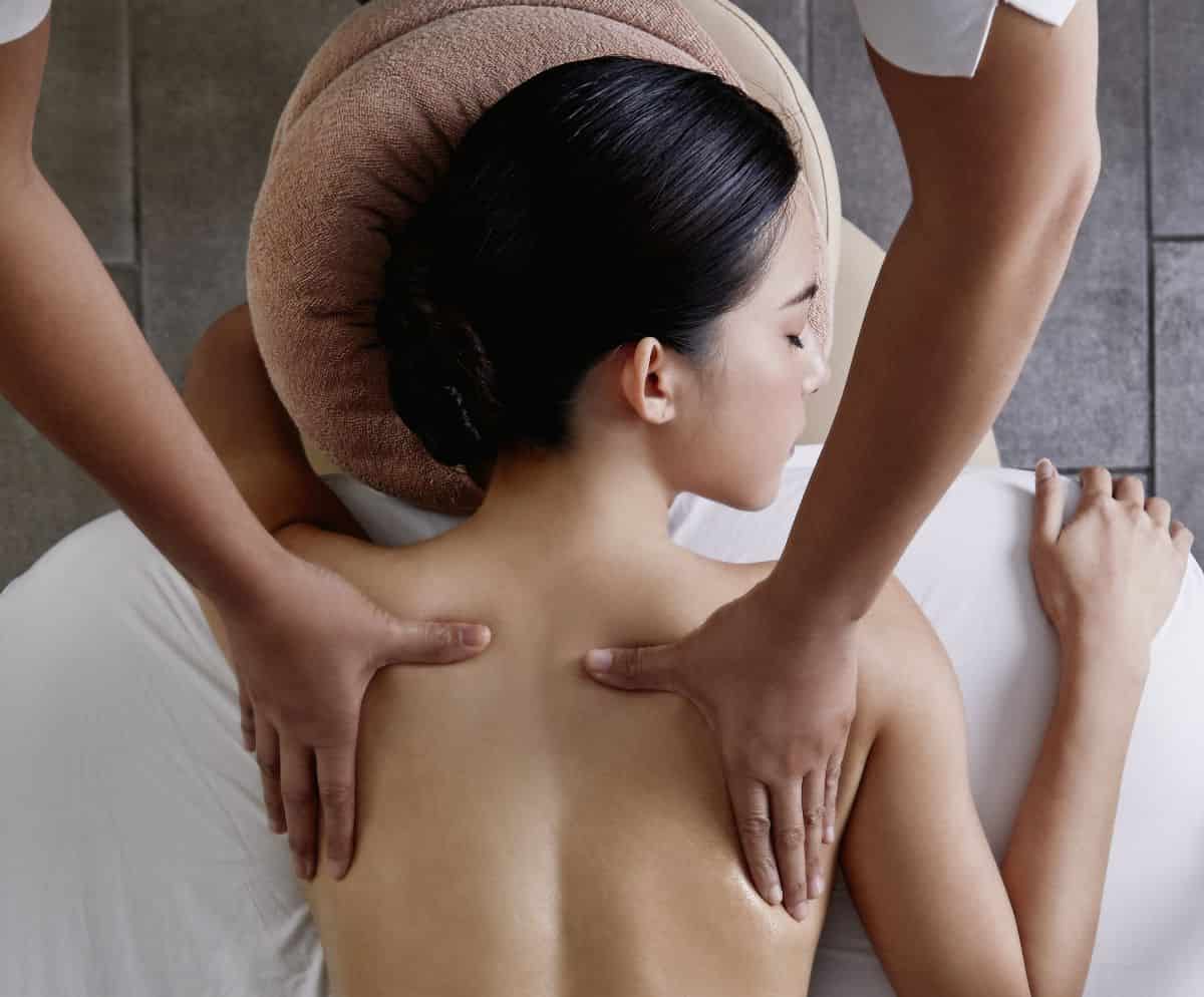 A woman enjoying a Thai massage