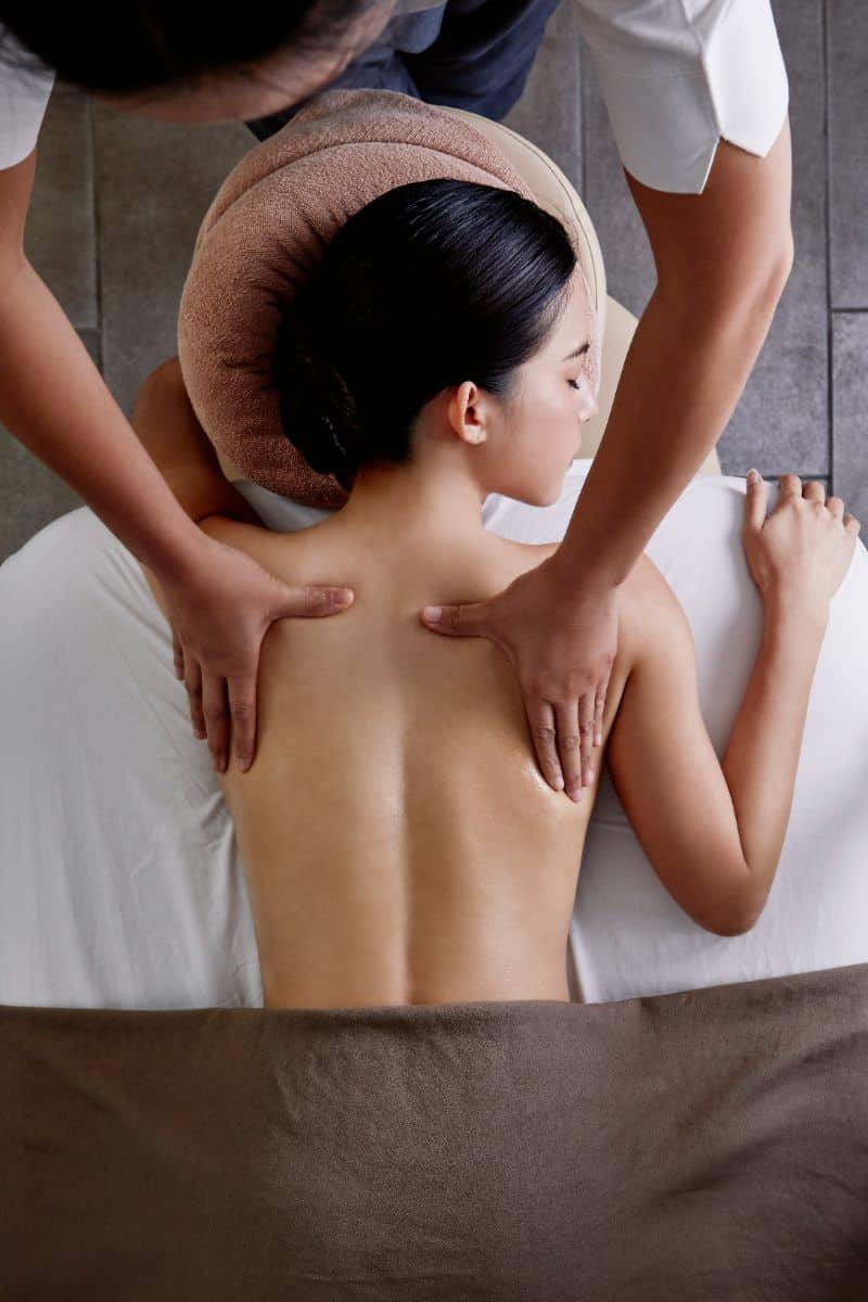 A woman enjoying a Thai massage