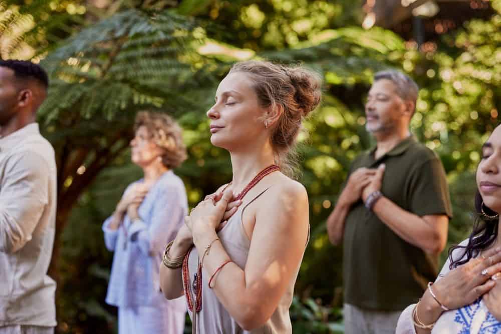 A group of people practicing mindfulness - a rising health trend 